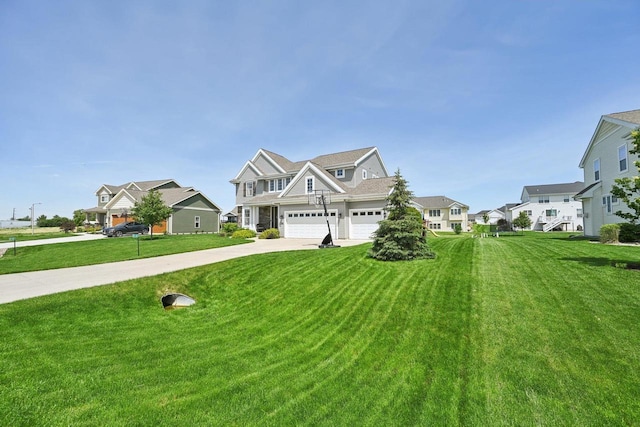 view of front of home with a front lawn and a garage