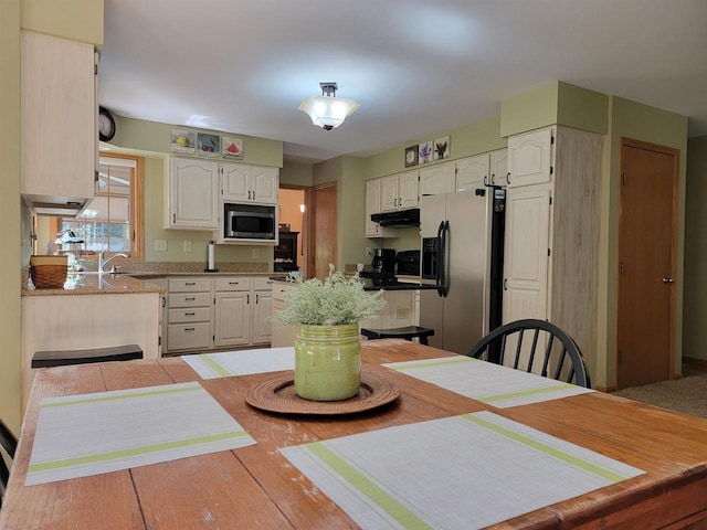 kitchen featuring light tile patterned flooring, sink, white cabinetry, and stainless steel appliances