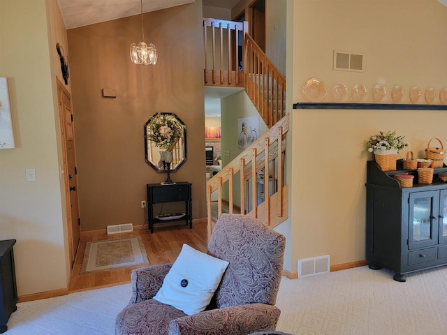 interior space featuring a high ceiling and an inviting chandelier