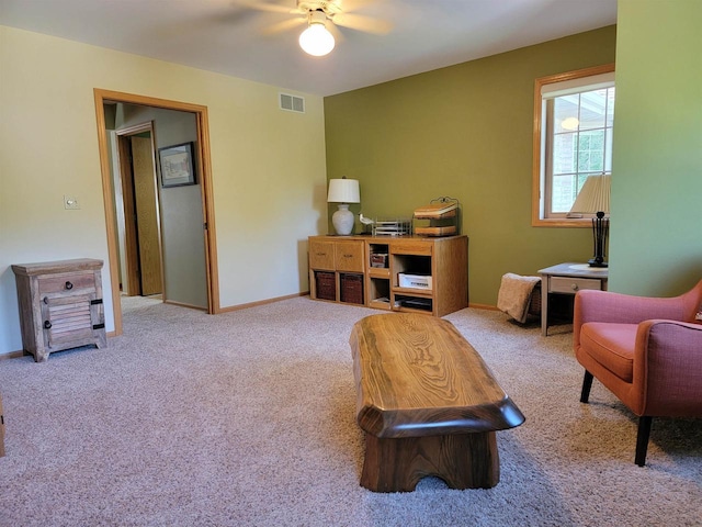 interior space with ceiling fan