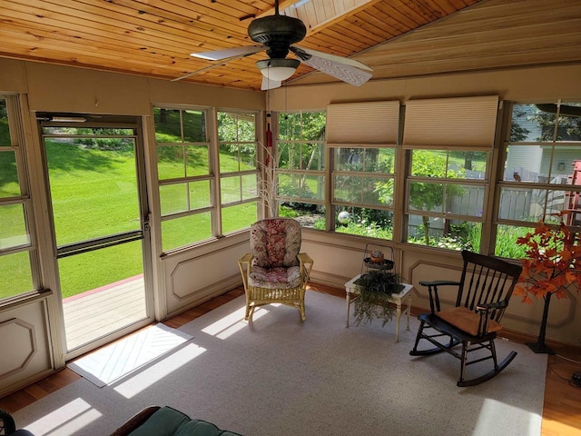 sunroom / solarium with ceiling fan and wood ceiling