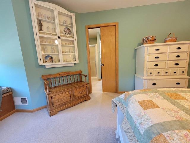 bedroom with light colored carpet