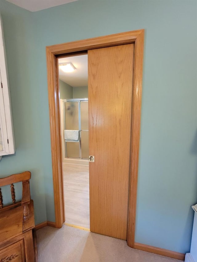 corridor with light colored carpet