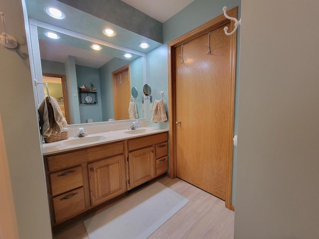 bathroom featuring vanity and hardwood / wood-style flooring