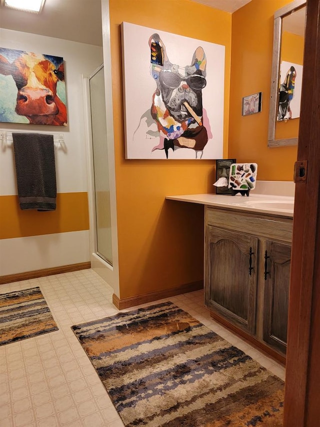 bathroom with vanity and an enclosed shower