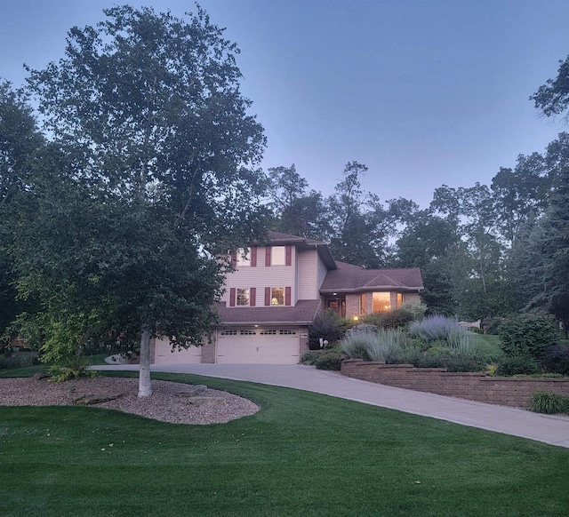 view of front of house featuring a front yard and a garage