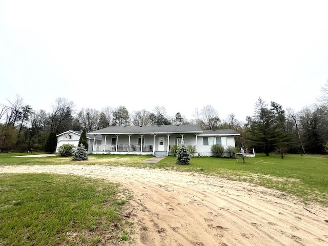 single story home featuring a front lawn and a porch