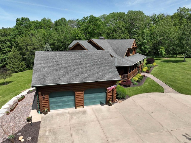 view of front of property with a front yard and a garage