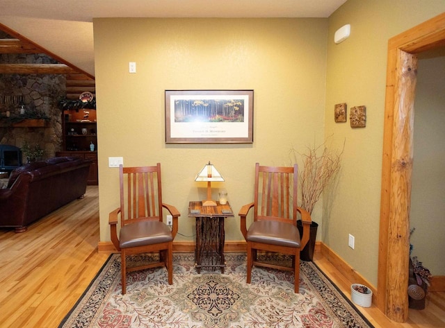 sitting room with hardwood / wood-style floors