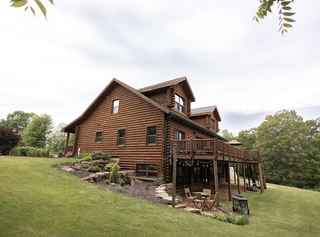 view of property exterior with a wooden deck, a yard, and a patio