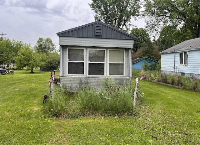 view of property exterior featuring a lawn