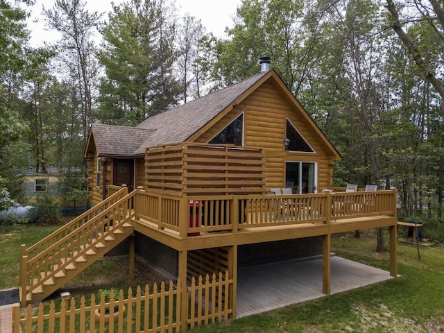 rear view of house with a deck and a patio area