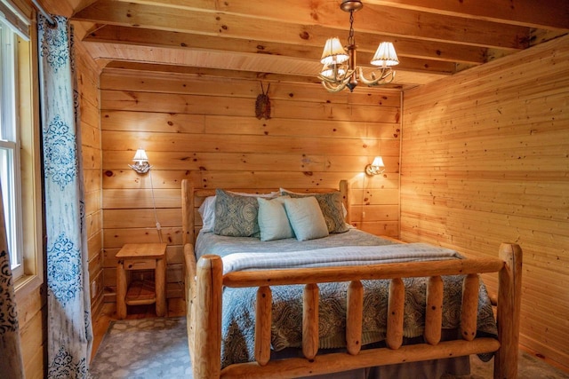 unfurnished bedroom with beam ceiling, wooden walls, and an inviting chandelier