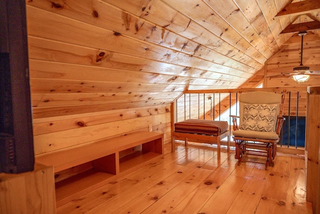 additional living space with wooden ceiling, light hardwood / wood-style flooring, lofted ceiling, and wood walls