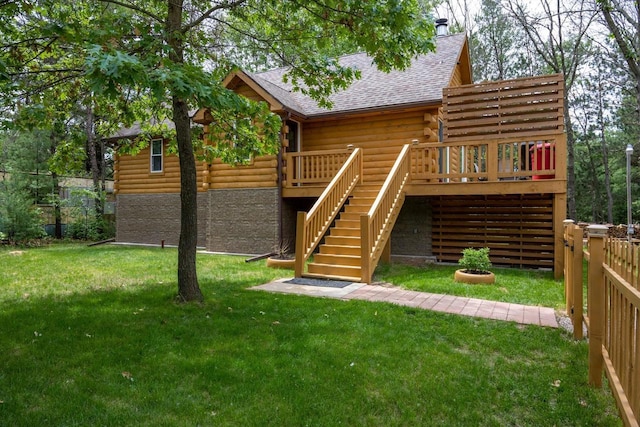 back of property featuring a yard and a deck