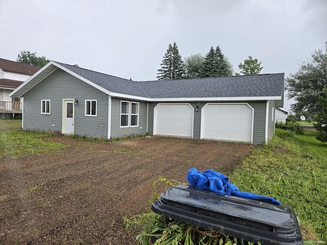 ranch-style home with a garage