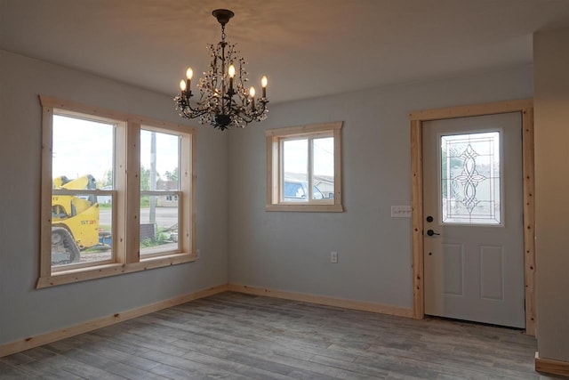 foyer featuring plenty of natural light and light hardwood / wood-style flooring