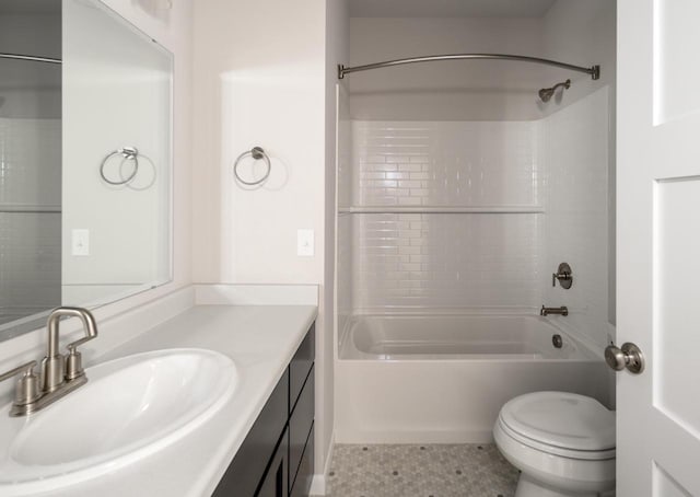 full bathroom featuring tile patterned flooring, vanity, tiled shower / bath combo, and toilet