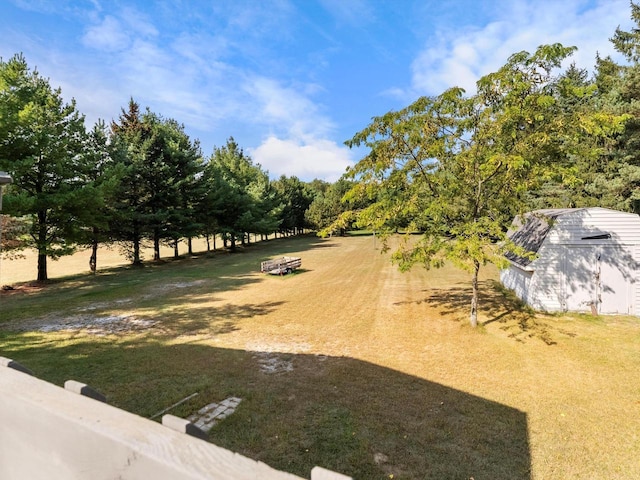 view of yard with a rural view