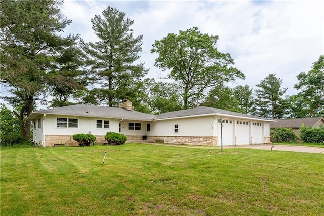 view of front of property with a garage and a front yard