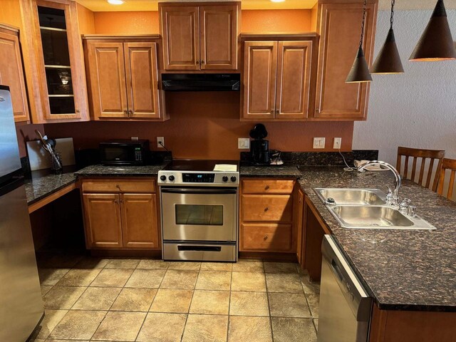 kitchen with hanging light fixtures, sink, and appliances with stainless steel finishes