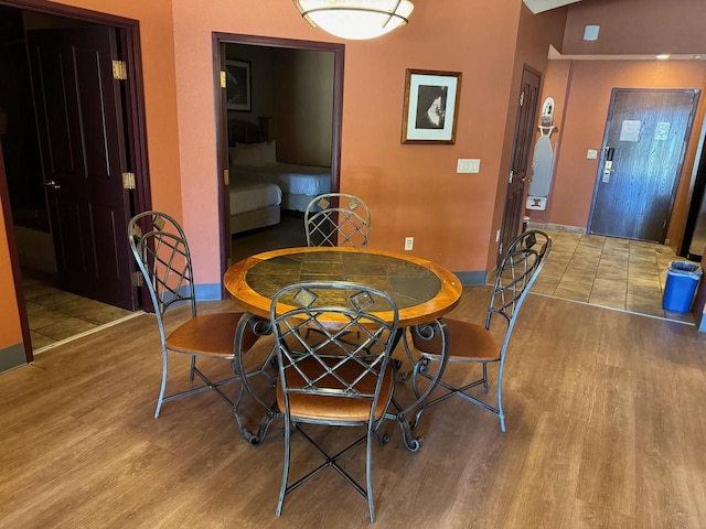 dining space with light hardwood / wood-style flooring