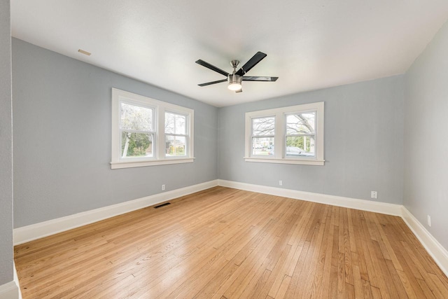 spare room featuring ceiling fan and light wood-type flooring