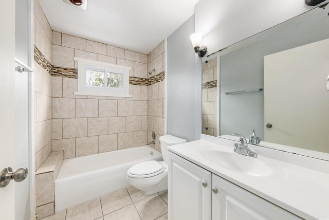 full bathroom featuring tile patterned flooring, vanity, toilet, and tiled shower / bath