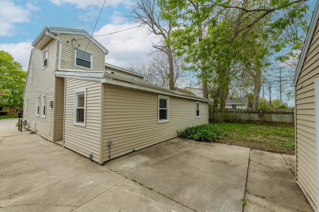 view of side of property with a patio area