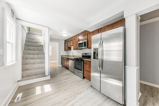 kitchen featuring light hardwood / wood-style floors and stainless steel appliances