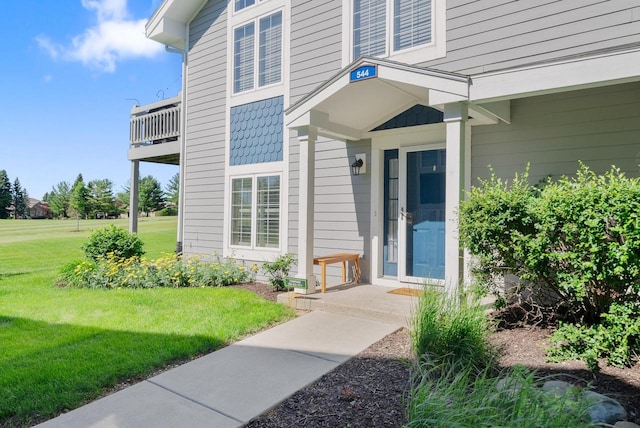 property entrance with a yard