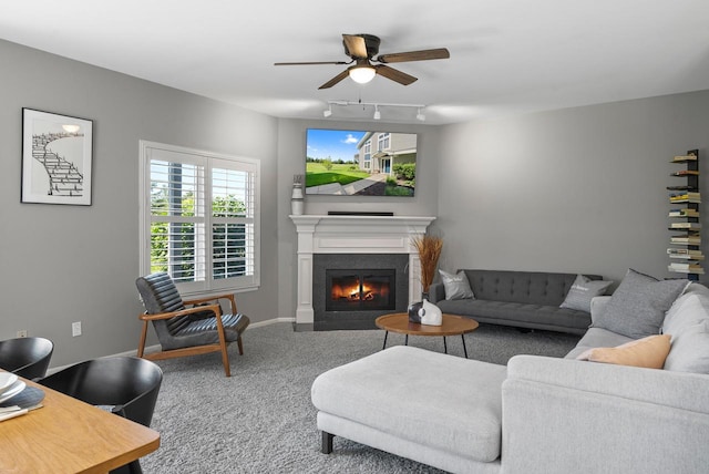 living room featuring carpet flooring, ceiling fan, and track lighting