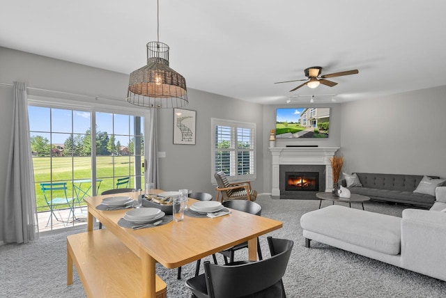 dining room featuring carpet flooring and ceiling fan