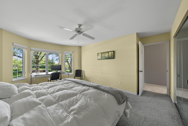 bedroom featuring light colored carpet and ceiling fan