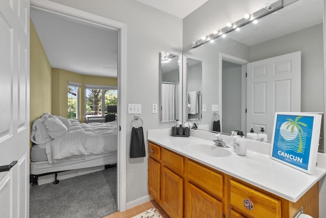 bathroom featuring tile patterned flooring and vanity