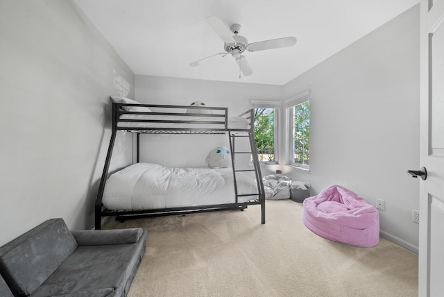 bedroom with ceiling fan and carpet