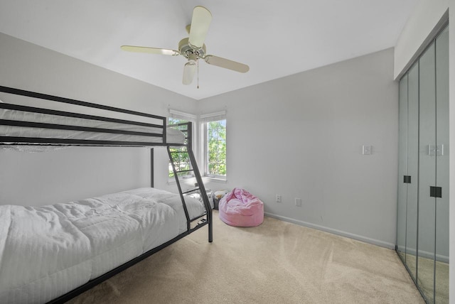 carpeted bedroom featuring ceiling fan