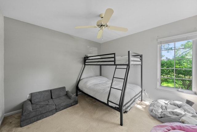 bedroom with ceiling fan and carpet floors