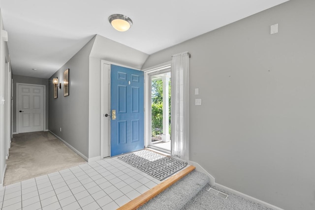 view of carpeted foyer