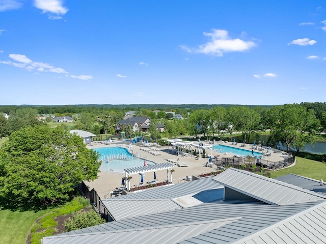 view of swimming pool featuring a pergola and a patio