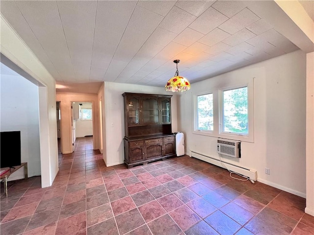 unfurnished dining area with a wall mounted air conditioner and a baseboard heating unit