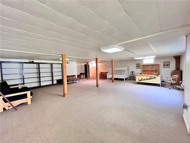 basement featuring carpet flooring