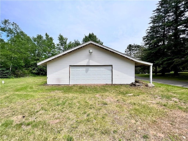 garage with a yard