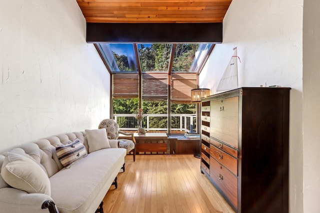 sunroom featuring a healthy amount of sunlight and wood ceiling