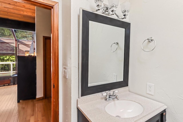 bathroom featuring vanity and hardwood / wood-style flooring