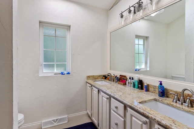 bathroom with vanity and toilet