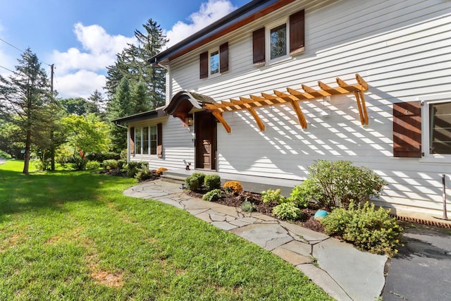 view of side of property with a yard