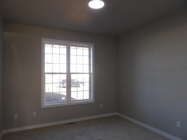 spare room with carpet flooring