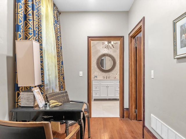 hallway with light wood-type flooring