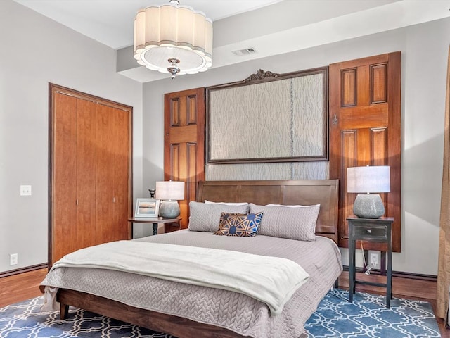 bedroom featuring dark hardwood / wood-style flooring